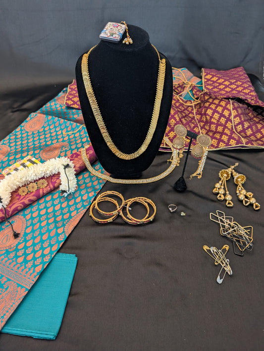 Teal Blue Designer Saree with Bronze Designs & Purple Headpiece – Full Set